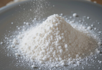 A white powdery substance is piled on a plate