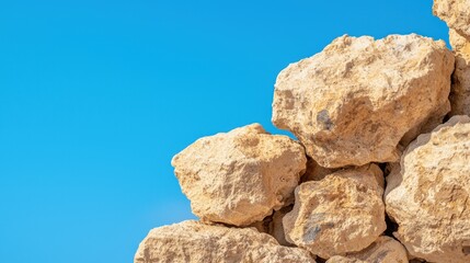 Geology rock analysis Concept, Close-up of Ancient Rock Formation with Embedded Textures Set Against Clear Blue Sky