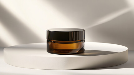 a luxury cosmetic jar with a dark amber color and a gold lid, set against a plain, light-colored background.