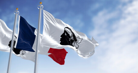 Flags of Corsica waving in the wind on a clear day