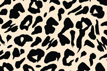 Seamless leopard print pattern with bold black spots on a beige background. Ideal for fabric, wallpaper, textile, and fashion design.