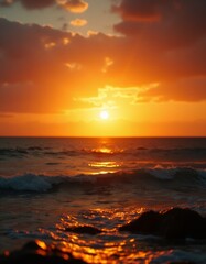 Obraz premium A sunset over the ocean with the sun setting in the distance
