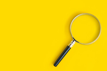 magnifying glass isolated on yellow