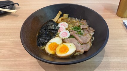 Japanese ramen with pork, egg, and narutomaki in broth