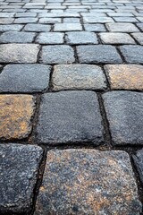 Textured cobblestone pavement background with gray and orange hues creating a vintage urban scene and geometric pattern ideal for city life