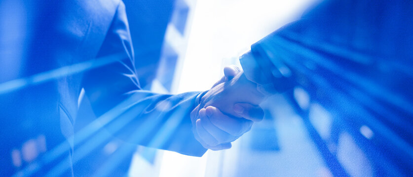 Businessman handshake for teamwork of business merger and acquisition,successful negotiate,hand shake,two businessman shake hand with partner to celebration partnership and business deal 