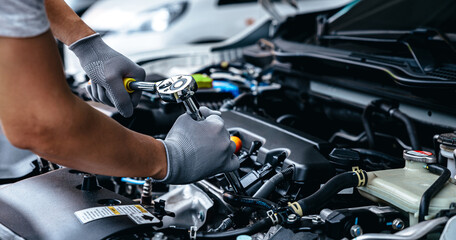 Car care maintenance and servicing, Hand technician auto mechanic checking inspection list after...