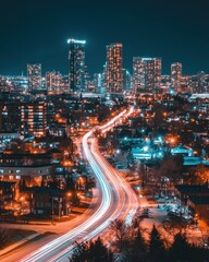 Obraz premium Captivating urban nightscape featuring vibrant light trails weaving through a modern city skyline at twilight scenic view