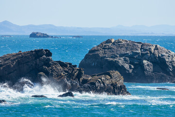 Coastal cliffs along California's Highway 1 in Northern California. Rugged ocean rocks, crashing...