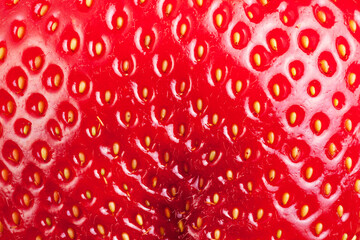 Structure of red strawberry skin close up.