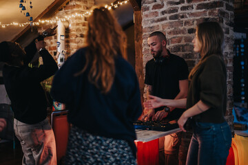 A group of young adults engaged in a festive gathering, featuring music by a DJ and enthusiastic...