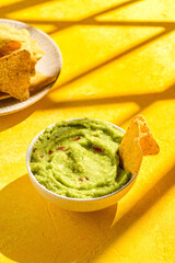 Nachos with guacamole, traditional Mexican snack