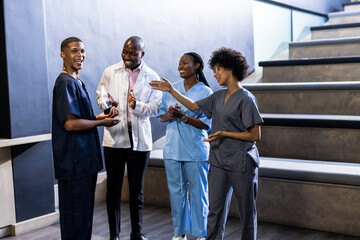 medical diverse team celebrating achievement with award in hospital hallway, at conference hall