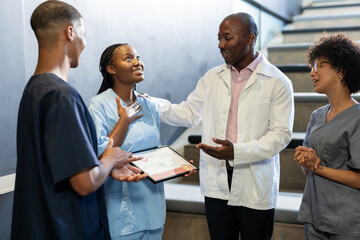 In hospital, healthcare diverse professionals celebrating nurse receiving award, at conference hall