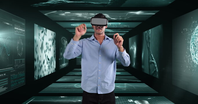 Image of businessman wearing vr headset over screens with medical data processing