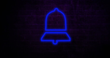 Neon blue bell icon glowing against dark brick wall, creating modern ambiance