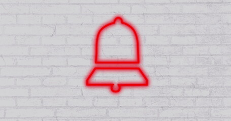 Red neon bell icon glowing against white brick wall, symbolizing notifications