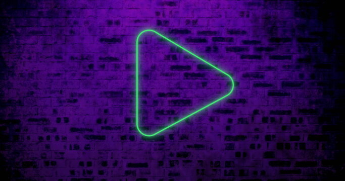 Neon green play button glowing on purple brick wall, creating vibrant contrast - Powered by Adobe