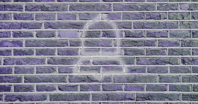 Neon bell icon glowing on textured brick wall, creating urban art vibe