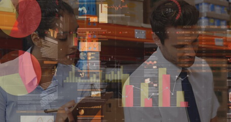Statistical data processing against diverse male and female supervisor checking stock at warehouse