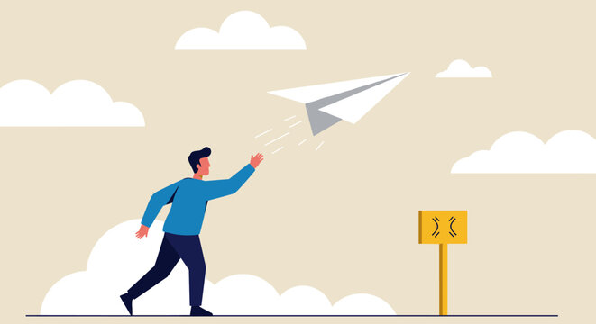 Man reaching for a paper airplane soaring in the sky.