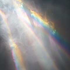 Intense mist in a white void. Multiple rainbow streaks shine through the mist. Light is refracting off of particles of mist.