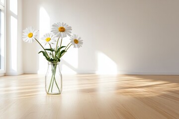 Daisies in glass vase on wooden floor	