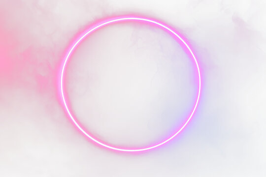 Glowing neon pink circle in smoky red and blue background.