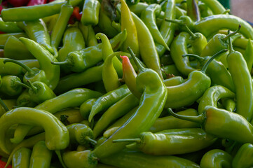 Green chili peppers gathered in a vibrant market setting showcasing fresh produce and local farming excellence
