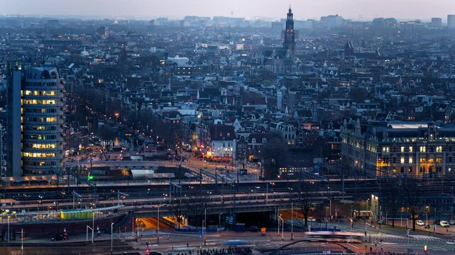 Amsterdam cityscape at night with illuminated streets, moving trains, and historical architecture. A vibrant urban skyline blending modern transit with classic Dutch charm. Timelapse shot.