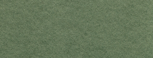 Texture of craft green and olive paper background colors, macro. Structure of vintage kraft khaki cardboard.