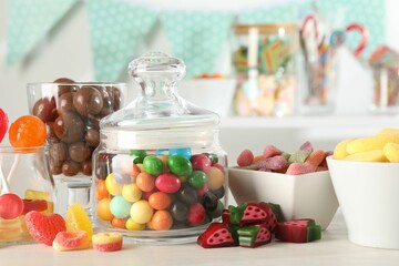 Candy bar. Many different sweets on white table indoors, closeup