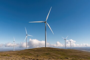 row of wind turbines on hill against clear blue sky rotating gently with ample copy space below for text turbines stand