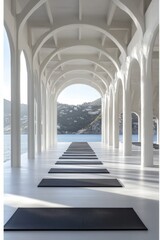 Fototapeta premium Serene yoga studio overlooking the ocean with white columns and arches creating a peaceful atmosphere for wellness and meditation retreat