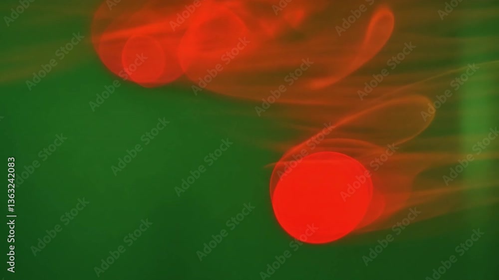 Poster abstract red dots: a captivating display of blurred red circular forms against a deep emerald backgr