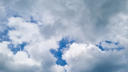 Stratus clouds dance across the sky in the afternoon, their shapes intricate and distinct. Cotton tufts of cumulus clouds intertwine with stratus, smooth expanses of stratus clouds