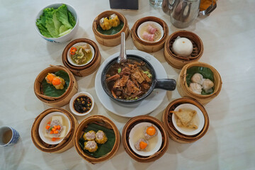 Breakfast Dim sum at a Chinese restaurant, Krabi, Thailand. Variety of chinese dimsum for breakfast, yumcha, dim sum in bamboo steamer, chinese cuisine