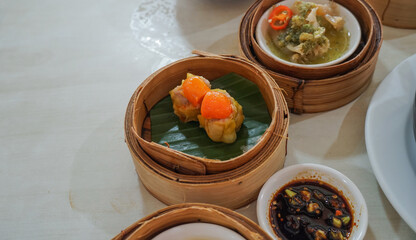 Breakfast Dim sum at a Chinese restaurant, Krabi, Thailand. Variety of chinese dimsum for breakfast, yumcha, dim sum in bamboo steamer, chinese cuisine