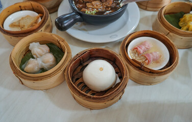 Breakfast Dim sum at a Chinese restaurant, Krabi, Thailand. Variety of chinese dimsum for breakfast, yumcha, dim sum in bamboo steamer, chinese cuisine