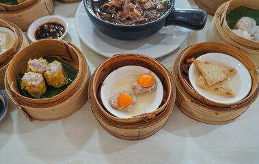 Breakfast Dim sum at a Chinese restaurant, Krabi, Thailand. Variety of chinese dimsum for breakfast, yumcha, dim sum in bamboo steamer, chinese cuisine