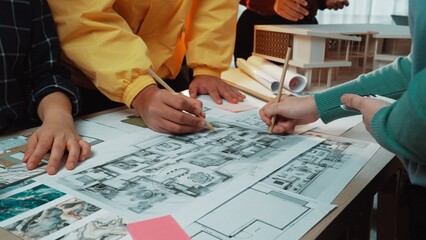 A vibrant scene showcasing a collaborative design session among professionals immersed in detailed...