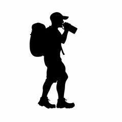 Silhouette of hiker drinking water from bottle with backpack

