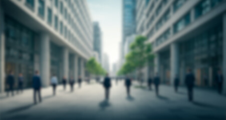 Obraz premium Blurred background of a group of executives walking down the street in a big city with buildings