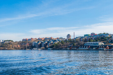 Fototapeta premium Apartment buildings in housing estate along embankment in Stockholm, Sweden