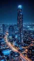 Obraz premium Captivating aerial view of a modern city skyline at night featuring illuminated skyscrapers and a vibrant urban landscape creating a dynamic and cinematic scene