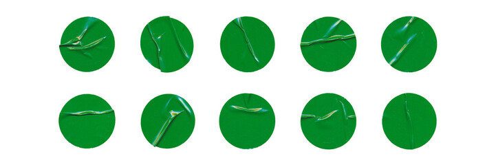 Big set of green glossy paper circles with creases, isolated blank round sticker on transparent...