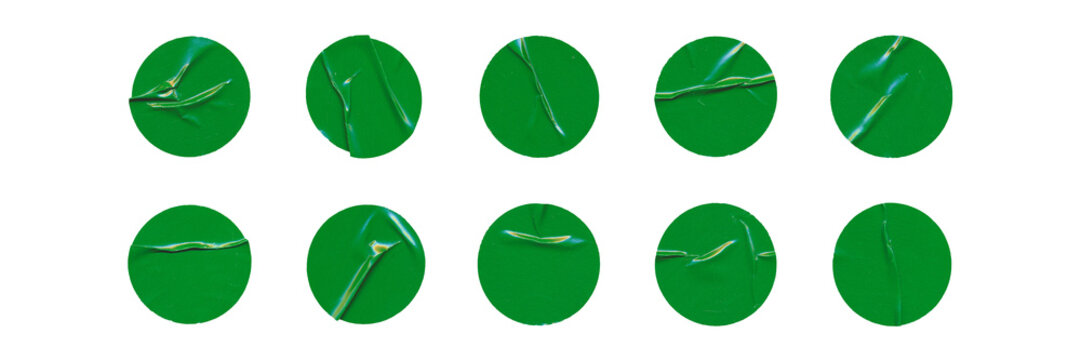 Big set of green glossy paper circles with creases, isolated blank round sticker on transparent background