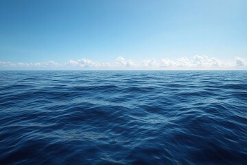 Obraz premium Serene ocean view on a bright, sunny day. The deep blue water meets a clear sky with fluffy white clouds.