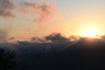 beautiful, cloudy sunrise with wisps of fog