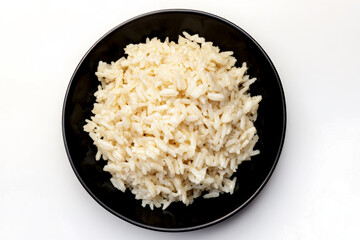 a black bowl filled with rice on a white surface cutout and isolated on transparent background 